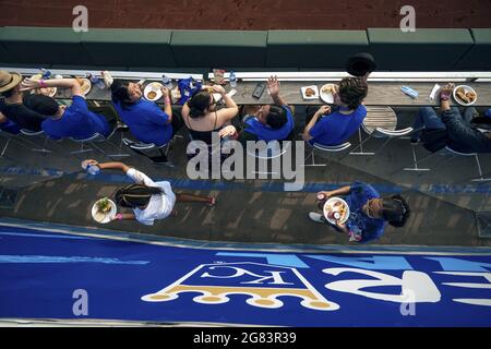 Kansas City, USA. 16th July, 2021. Fans eat before the Kansas City Royals and the Baltimore Orioles at Kaufman Stadium in Kansas City, Missouri on Friday, July 16, 2021. Photo by Kyle Rivas/UPI Credit: UPI/Alamy Live News Stock Photo