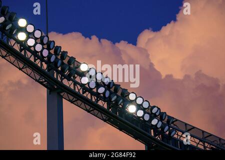 Kansas City, USA. 16th July, 2021. Clouds light up the stadium as the Baltimore Orioles take on the Kansas City Royals at Kaufman Stadium in Kansas City, Missouri on Friday, July 16, 2021. Photo by Kyle Rivas/UPI Credit: UPI/Alamy Live News Stock Photo