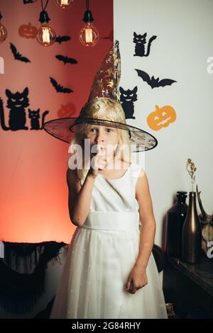 Shhh, Shh. Secret and gift Childrens costumes for the celebration of Halloween. Happy laughing kid in costume to halloween. Happy people. Having fun. Stock Photo