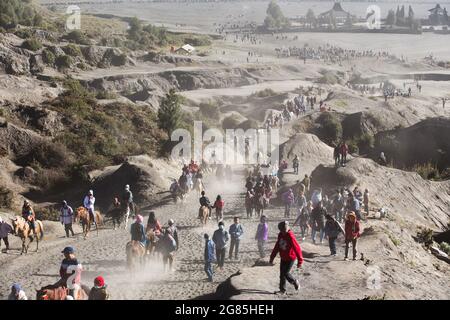 bunch of People hike to the top of the  mountain in bromo indonesia Stock Photo