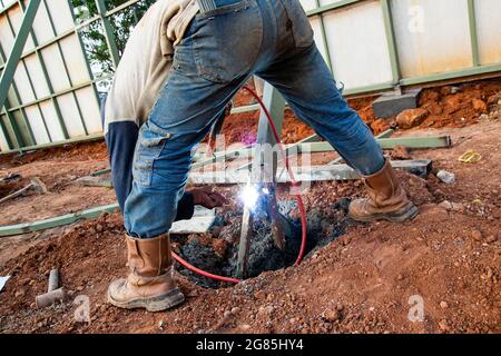 A worker doing welding on construction site Stock Photo