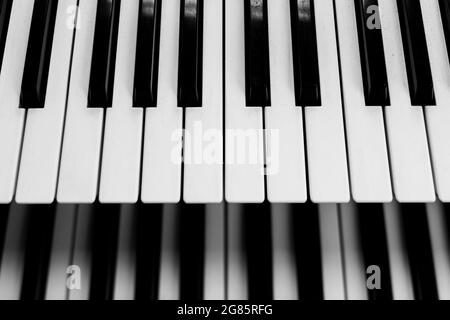 Close focus on upper row of piano keyboard in black and white. Stock Photo