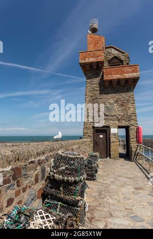 Rhenish Tower a Grade II Listed Building on The Esplanade at Lynmouth Devon, England, UK.  Lobster pots and a seagull on the harbour wall, Stock Photo