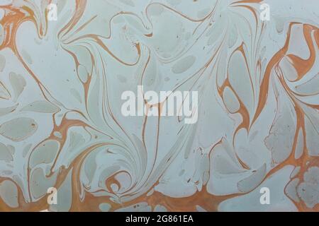 Smooth background of gray and orange paint mixture Stock Photo