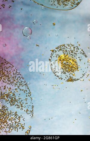 Macro shot of air and oil bubbles inside the water base forming patterns Stock Photo