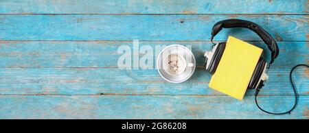 audio book concept with large heap of books and vintage headphones,literature,relaxation,entertainment,education, flat lay,good copy space Stock Photo