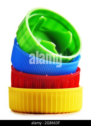 Colorful plastic bottle caps isolated on white. Recycling Stock Photo
