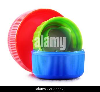 Colorful plastic bottle caps isolated on white. Recycling Stock Photo