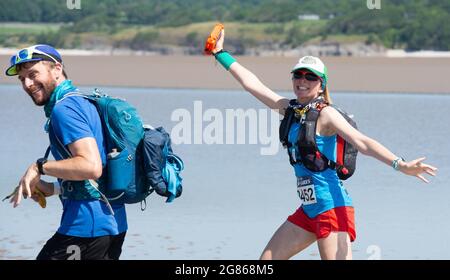 Silverdale, Carnforth, Lancashire, UK. 17th July, 2021. A hot start for the runners in the Rat Race Man vs Lakes event as they set off over Morecambe Bay from Silverdale, Lancashire heading towards the finish at lake Coniston in the Lake District up to 30 miles later. Credit: John Eveson/Alamy Live News Stock Photo