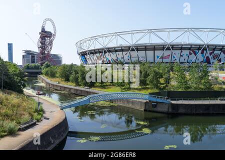 The Queen Elizabeth Olympic Park on a sunny day with the West Hams London Stadium in the distance. London - 17th July 2021 Stock Photo