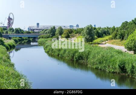 The Queen Elizabeth Olympic Park on a sunny day with the West Hams London Stadium in the distance. London - 17th July 2021 Stock Photo