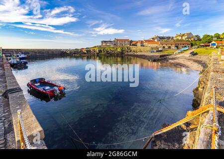 The small fishing village of Craster, with its picturesque harbour, on the coast of Northumberland, England, Uk Stock Photo