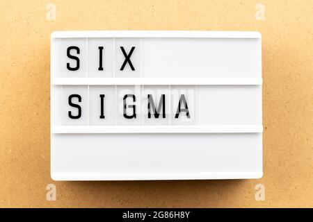 Light box with word six sigma on wood background Stock Photo