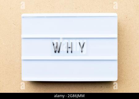 White lightbox with word why on wood background Stock Photo