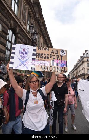 Paris, France. 17th July, 2021. Several tens of thousands of people demontrate against the covid-19 vaccination and health pass, at the call of Florian Philipot and Nicolas Dupond-Aignan, in Paris, France, on July 17, 2021. Photo by Pierrick Villette/Avenir Pictures/ABACAPRESS.COM Credit: Abaca Press/Alamy Live News Stock Photo