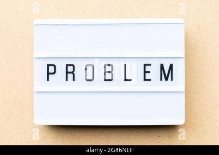 White lightbox with word problem on wood background Stock Photo