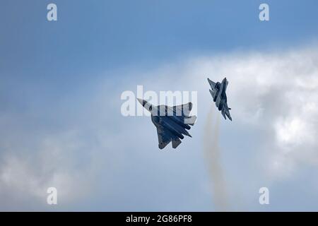 New Russian five generation's fighters SU 57, T-50 shows aerial maneuver battle at Moscow International Aviation and Space Salon MAKS 2019. RUSSIA Stock Photo