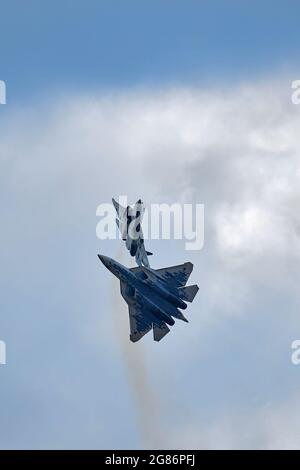 New Russian five generation's fighters SU 57, T-50 shows aerial maneuver battle at Moscow International Aviation and Space Salon MAKS 2019. RUSSIA Stock Photo