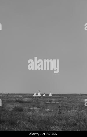 Native American tipi structures at the Plains Conservation Center in Aurora, Colorado; part of the prairie's indigenous history used for education. Stock Photo