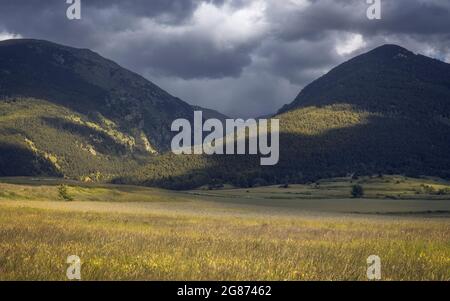Moody Mountrain Landscape Cloudy and Partially Sunny Stock Photo