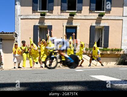 LIBOURNE to SAINT-EMILION , France, 17 July 2021, an ISN rider goes past some crazy fans dressed as bananas, Credit:Pete Goding/Goding Images/Alamy Live News Stock Photo