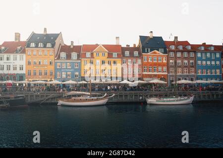 Nyhavn port and waterfront with famous bars and restaurants - Copenhagen, Denmark Stock Photo