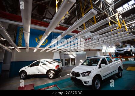 Kostanay,Kazakhstan,May14,2012: Saryarkaavtoprom auto-building plant. Ssangyong cars assembling line. Various types of automobiles on conveyor. Stock Photo