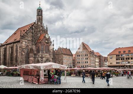 Nuremberg, Germany - May 17, 2016:  Frauenkirche church and Main Market Square in Nuermberg Stock Photo