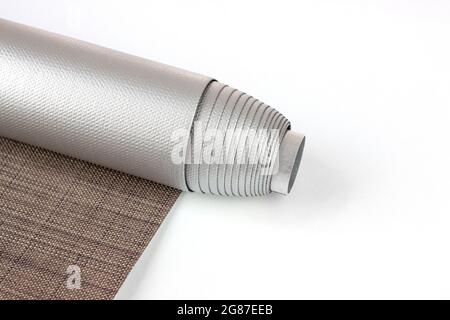 Roller blinds are made from texture material. Color blackout roller blind. Stock Photo