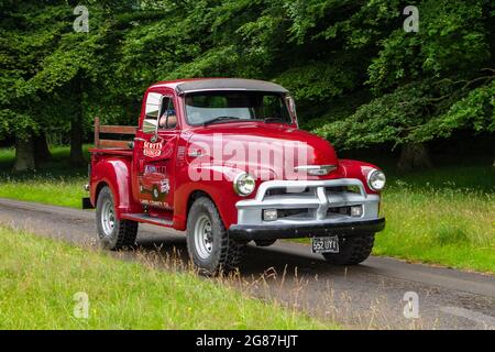 Red 1954 50s Scotts Chevrolet pick-up at ‘The Cars the Star Show” in Holker Hall & Gardens, Grange-over-Sands, UK Stock Photo