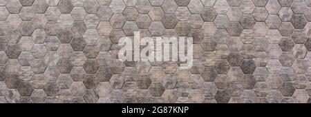 Hexagonal tile wall, gray hexagonal tile, outdoor wall, space for text. Panorama Stock Photo