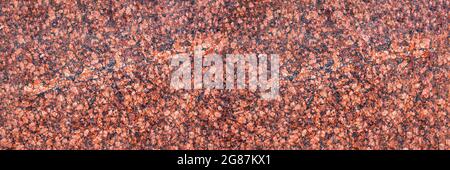 A closeup of a red granite slab can be used as a background. Stock Photo