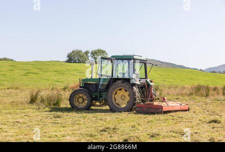 Kealkill, Bantry, Cork, Ireland. 17th June 2021.Farmer Seán O'Connor topping his field using a flail-type mower in Kealkill, Bantry, Co. Cork, Ireland. - Picture; David Creedon Stock Photo