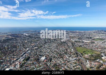 Aerial view of Newcastle showing many of the inner city surburbs through to the harbour and beaches area. Newcastle is a major city in NSW Stock Photo