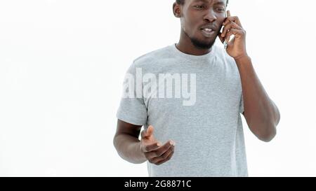 serious young man talking on his smartphone. photo with copy space Stock Photo