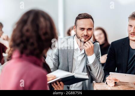 close up. brooding entrepreneur sitting at office Desk Stock Photo