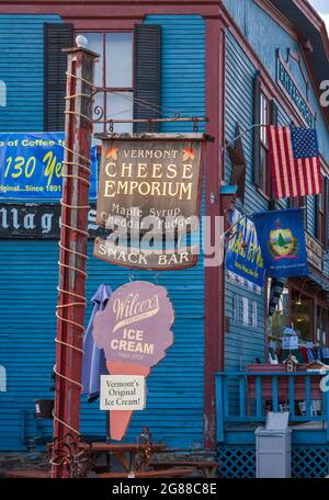 Post with vintage country store signs: Vermont Cheese Emporium and Wilcox's Premium Ice Cream. Weston Village Store, Weston, Vermont, USA. Stock Photo