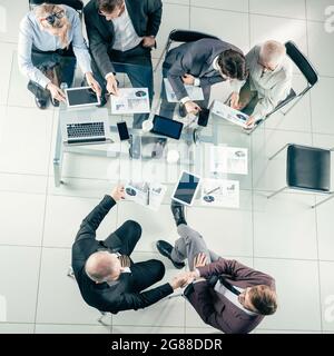 top view. working group analyzing financial statistics. Stock Photo