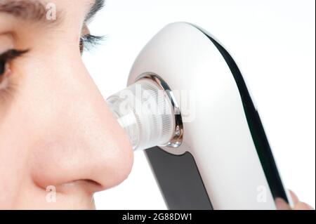 Facial cleaning theme. Woman remove blackheads from skin pores macro close up view Stock Photo