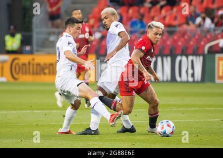 Toronto, Canada. 17th July, 2021. Yeferson Soteldo (30), Junior de Almeida also known as Junior Urso (11) and Mauricio Pereyra (10) in action during the MLS game between between Toronto FC and Orlando City SC at BMO Field. (Final score; Toronto FC 1-1 Orlando City SC). Credit: SOPA Images Limited/Alamy Live News Stock Photo