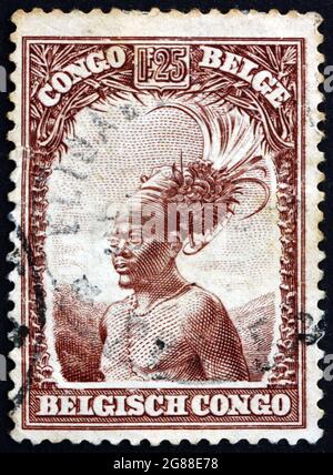 BELGIAN CONGO - CIRCA 1931: a stamp printed in Belgian Congo shows Mangbetu chief, circa 1931 Stock Photo