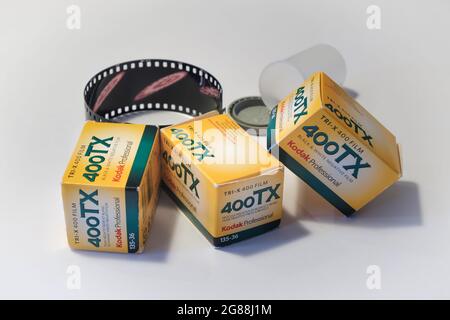 Vintage photograhy equipment with Kodak film roll boxes of Tri-X 400 black and white film and a developed piece of film roll on a smooth background Stock Photo