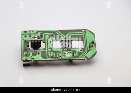 Circuit board from disassembled mouse device on white background Stock Photo