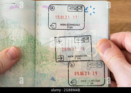 Austrian entry and exit visa stamps in a UK passport in 2021 following the United Kingdom leaving the EU Schengen Area and becoming a third country Stock Photo