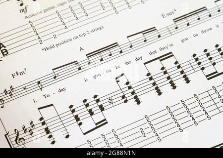 A guitar tab / tablature book showing the lyrics and music for the Oasis song 'Wonderwall' from their second album What's the Story Morning Glory Stock Photo