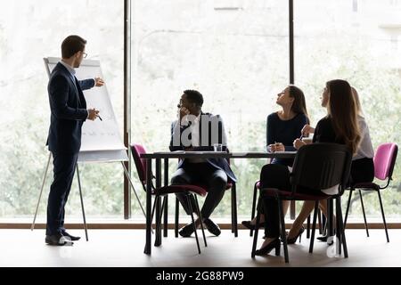 Confident business leader, boss, manager presenting marketing sales report Stock Photo