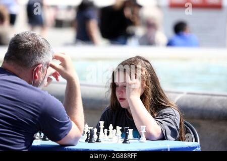 July 18, 2021, London, England, United Kingdom: People are seen playing chess in ChessFest in Londonâ€™s Trafalgar Square. (Credit Image: © Tayfun Salci/ZUMA Press Wire) Stock Photo