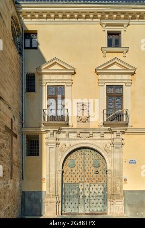 Main entrance door on the exterior facade of the Episcopal Palace in the city of Cuenca, Castilla la Mancha, Spain, Europe Stock Photo