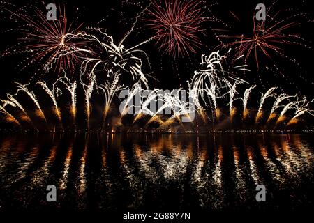 Fireworks explode over the St. Mark's Basin for the Redentore Celebrations during the night from 17 to 18 July, 2021 in Venice, Italy. Redentore Stock Photo