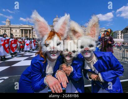 London 18 July 2021  Chess fest in Trafalgar Square, organized by the charity Chess in Schools and Communities, whose mission is to improve children’s educational outcomes and social development by introducing them to the game of chess. 32 actors dressed as Alice as the white queen with the bunny pawns Paul Quezada-Neiman/Alamy Live News Stock Photo
